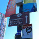 photo of signage in east village of san diego including a sign that points towards the "historic gaslight quarter"