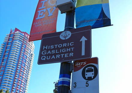 photo of signage in east village of san diego including a sign that points towards the "historic gaslight quarter"