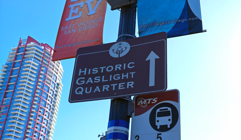 photo of signage in east village of san diego including a sign that points towards the "historic gaslight quarter"