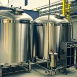 Breweries, Bakeries on the Rise in Yeast Village photo of brewery tanks